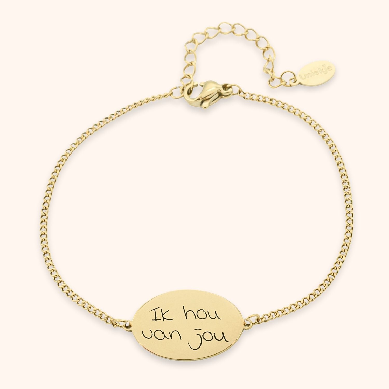 Armband met eigen handschrift gegraveerd op ovaal plaatje goud stainless steel.