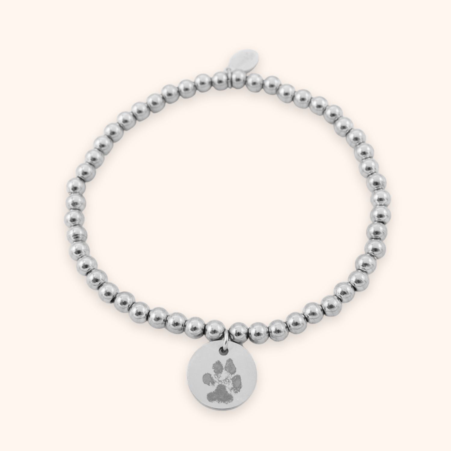 Dames armband pootafdruk gegraveerd op rond muntje zilver stainless steel