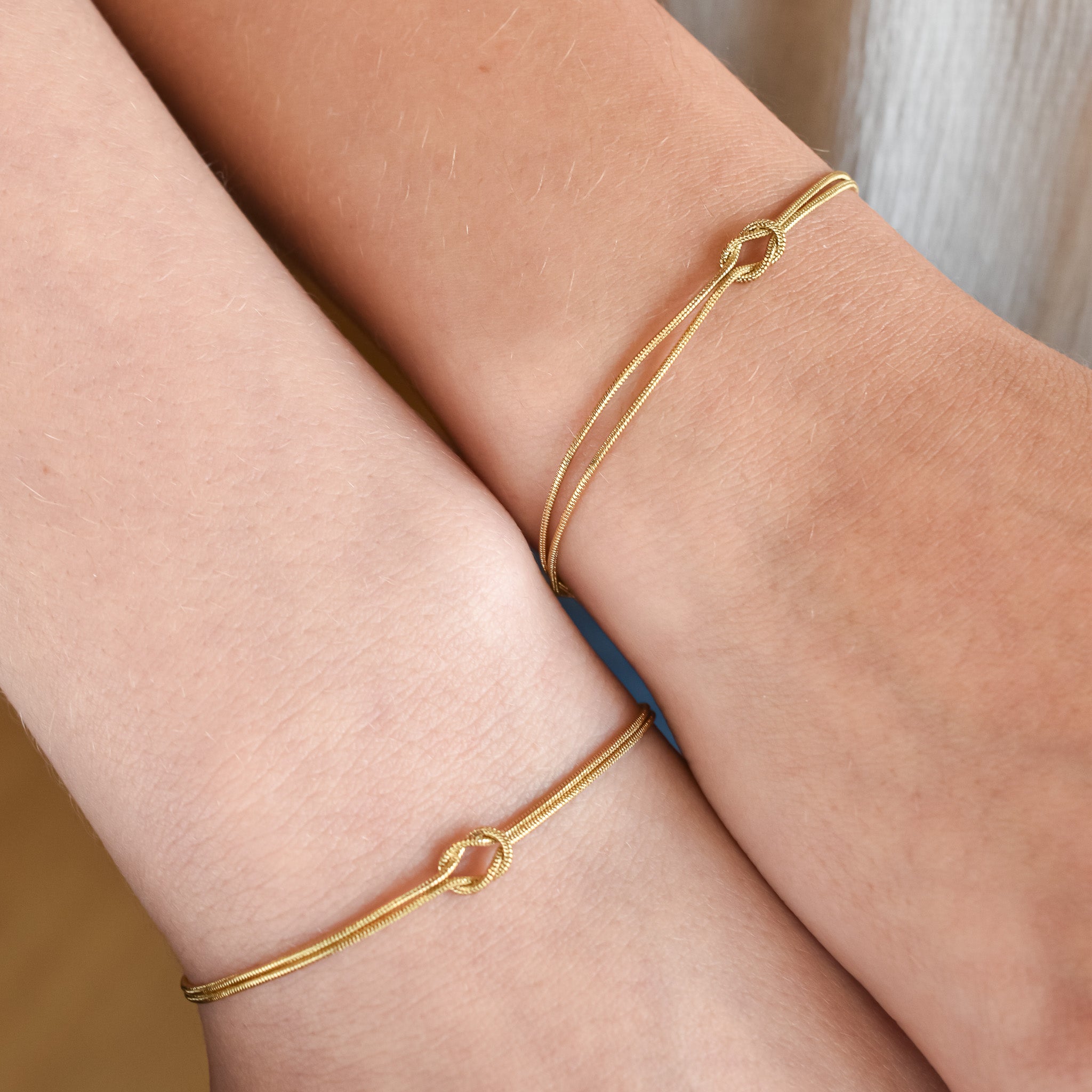 Armbanden setje verbonden knoopje kleur goud stainless steel