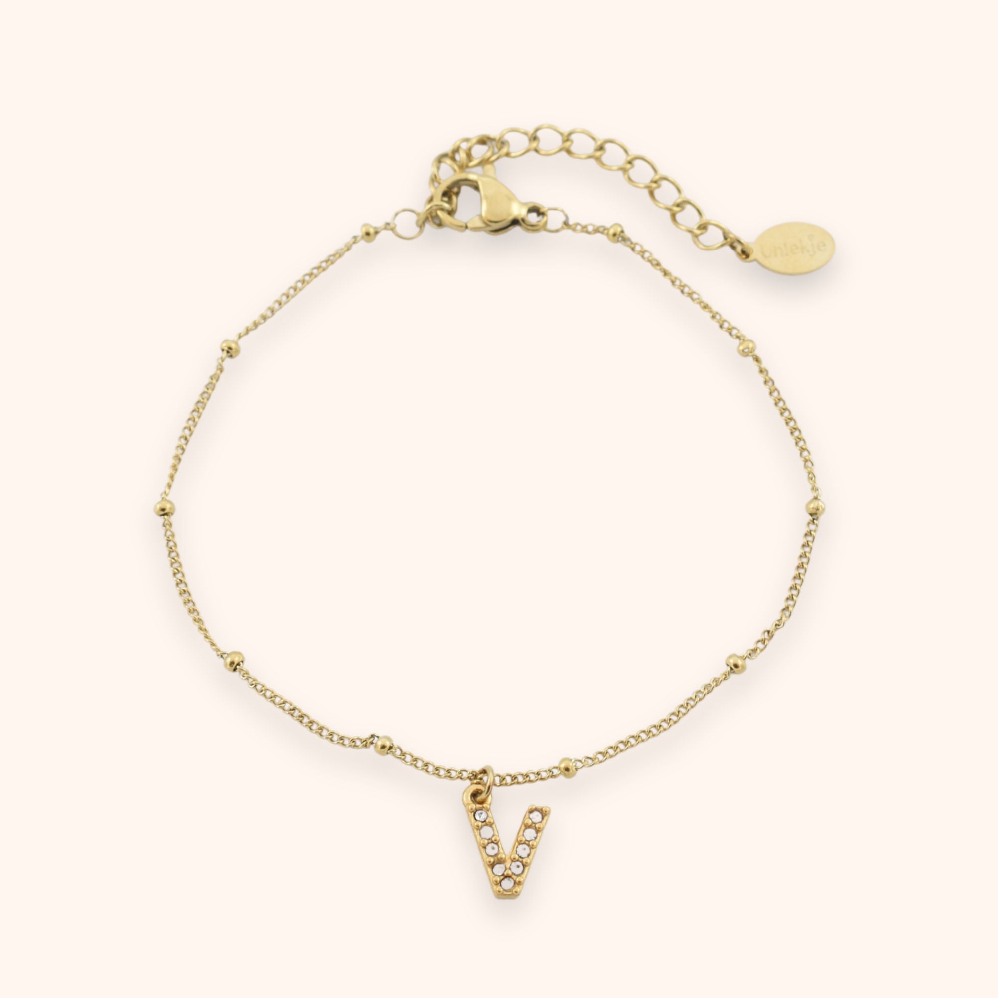 Dames schakel armbandje met letter hangertje goud stainless steel