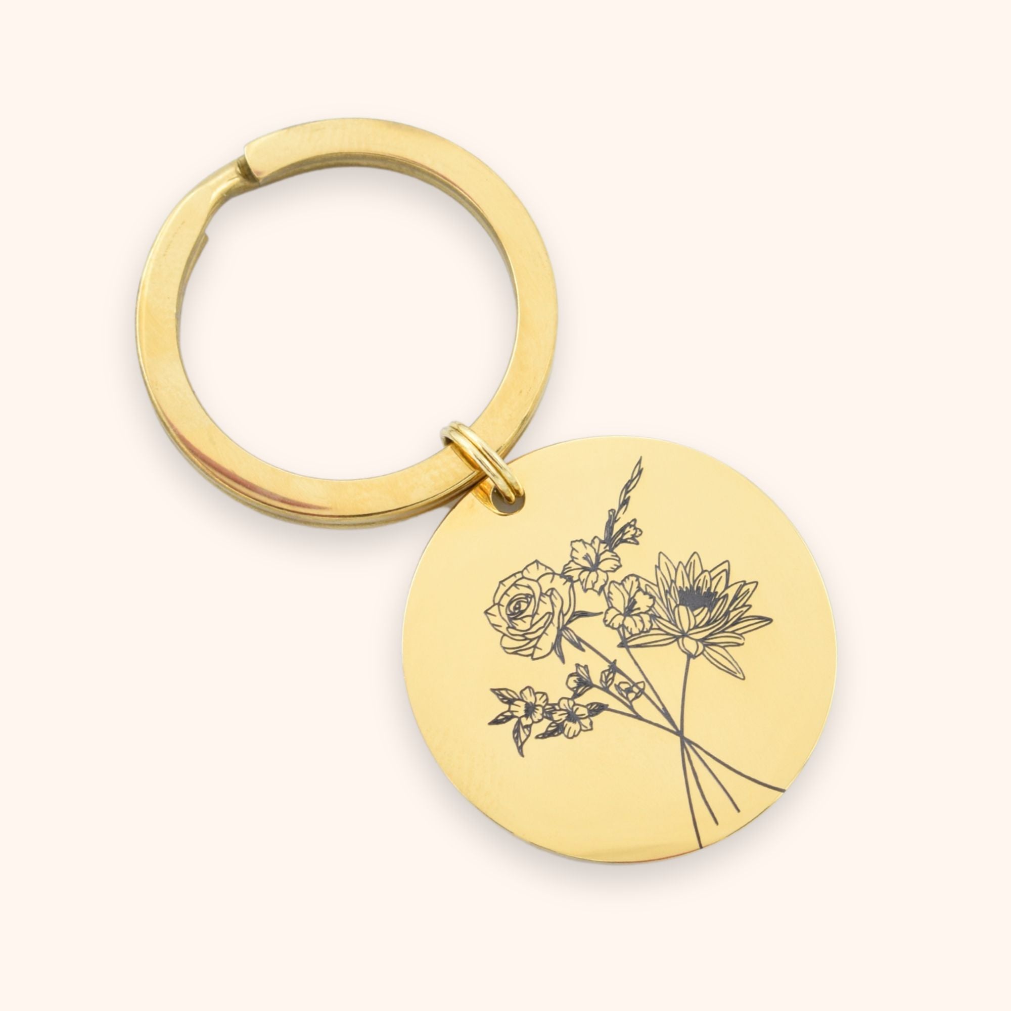 Ronde sleutelhanger gepersonaliseerd met meerdere geboortebloemen goud rvs