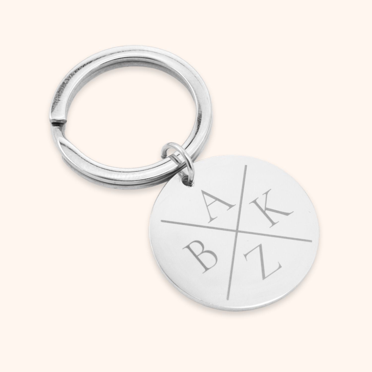 persoonlijke sleutelhanger graveren met 4 initialen zilver rondje