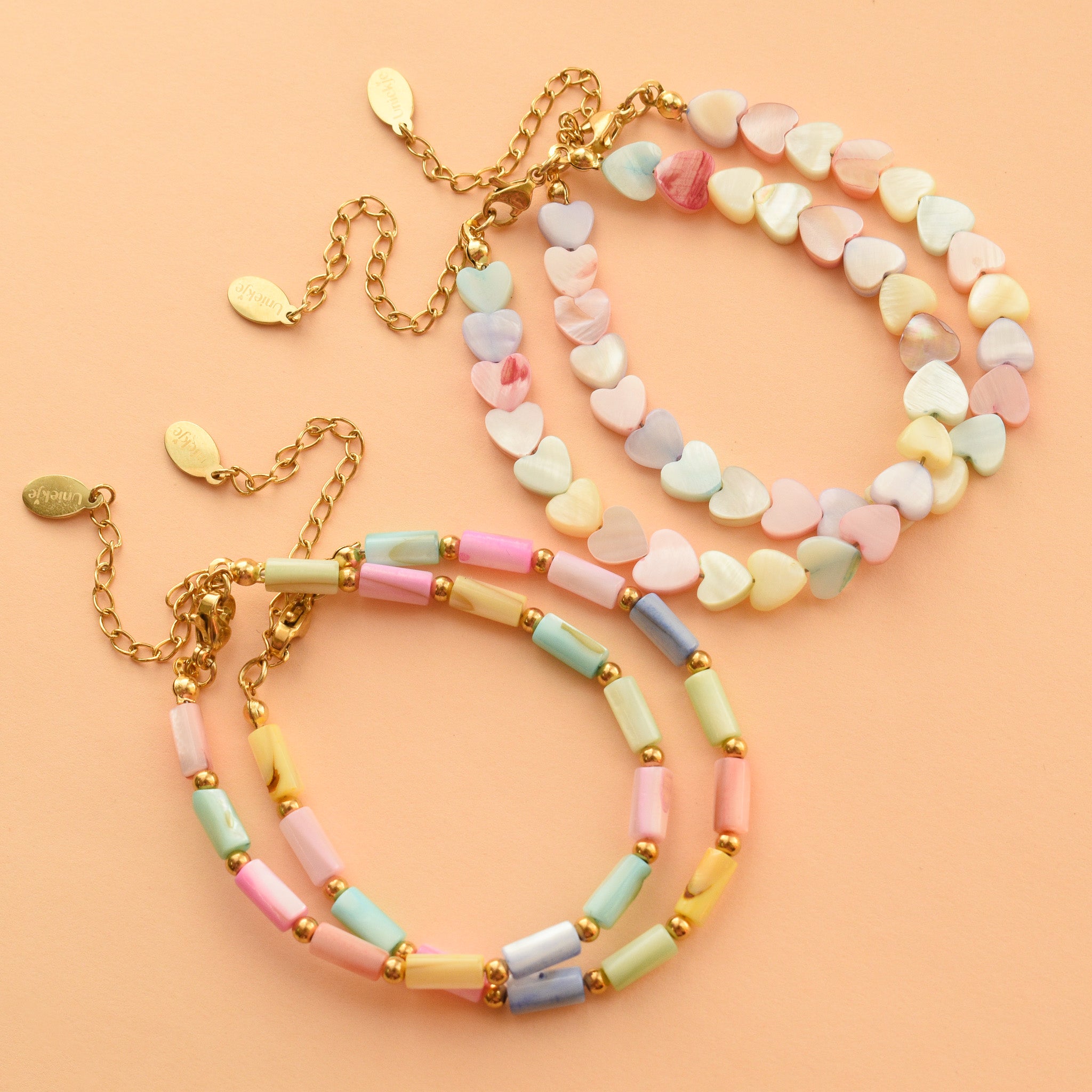 Zomerse kralen armbanden schelp pastel en kleurig goud rvs