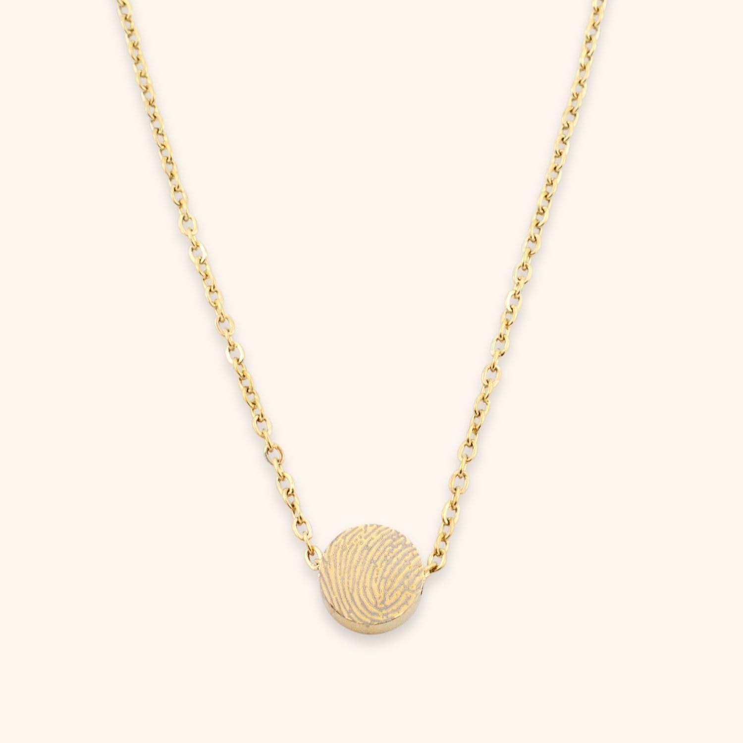 Fijne ketting met rond kraaltje gepersonaliseerd met een vingerafdruk goud