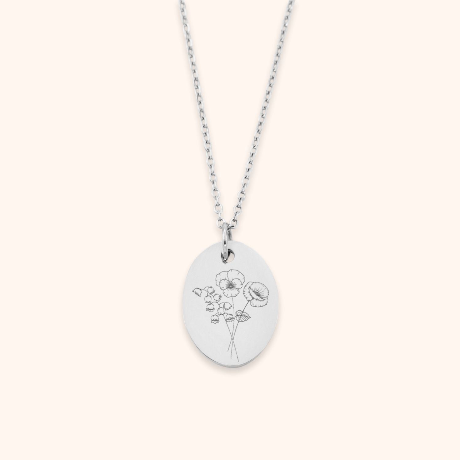 Ketting gepersonaliseerd met meerdere geboortebloemen op een ovale hanger zilver