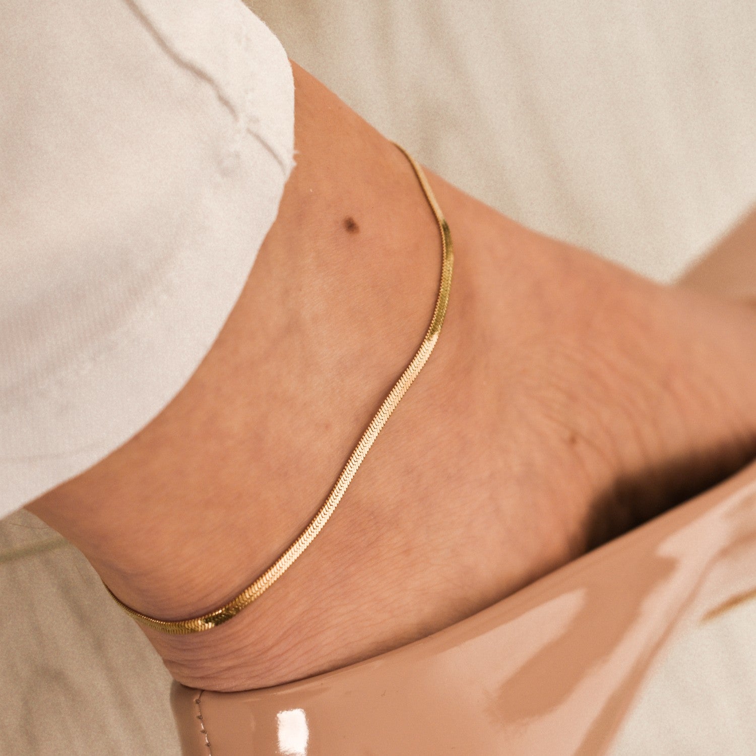 Enkelbandje snake chain platte schakel goud rvs